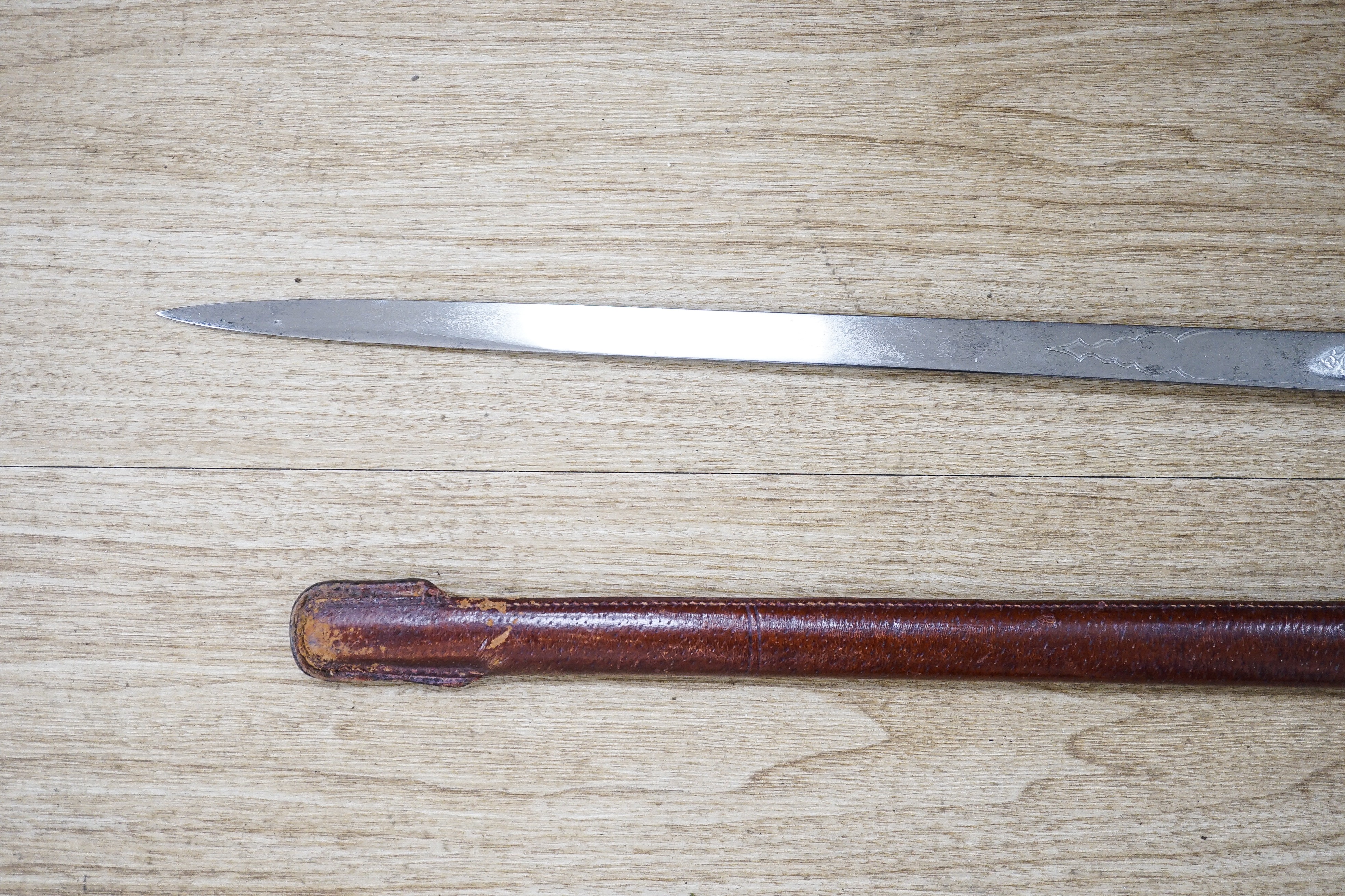 A George V Henry Wilkinson Royal Engineers dress sword with scabbard and cover, the blade etched GHL